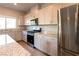 The kitchen features stainless steel appliances, granite countertops, and ample cabinet space for a modern touch at 480 Silverweed Ave, Henderson, NV 89044