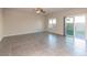 Spacious living room featuring tile floors and sliding glass doors at 480 Silverweed Ave, Henderson, NV 89044