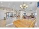 Bright and airy kitchen featuring an island with bar seating, stainless steel appliances, and open access to the living area at 5008 Tropical Ridge Ct, Las Vegas, NV 89130