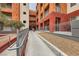 Exterior view of multi-story building featuring a ramp for accessibility and colorful facades at 51 E Agate Ave # 506, Las Vegas, NV 89123