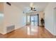 Spacious living room featuring hardwood floors, modern ceiling fan, and bright, natural light at 51 E Agate Ave # 506, Las Vegas, NV 89123