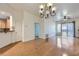 Bright, open floor plan with hardwood floors seamlessly connecting the living room and kitchen at 51 E Agate Ave # 506, Las Vegas, NV 89123