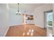 Hardwood floors, a hanging chandelier, and a small kitchen in a large room at 51 E Agate Ave # 506, Las Vegas, NV 89123