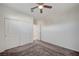 This bedroom has a ceiling fan and sliding closet doors at 513 Founders Creek Ave, North Las Vegas, NV 89084