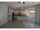 Open-concept kitchen with granite countertops and a staircase leading to the second floor at 513 Founders Creek Ave, North Las Vegas, NV 89084