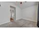 Bedroom featuring neutral carpeting, ceiling fan, and access to the hall at 540 Viva Serenade Way, Henderson, NV 89015