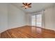 Bright bedroom features a vaulted ceiling, hardwood floors, and a sliding glass door that leads to the pool at 540 Viva Serenade Way, Henderson, NV 89015