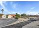 Single story home with a terra cotta roof, desert landscaping and an attached two car garage at 540 Viva Serenade Way, Henderson, NV 89015