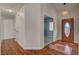 Inviting home foyer featuring wood floors and a decorative front door at 540 Viva Serenade Way, Henderson, NV 89015