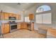 Well-lit kitchen area featuring stainless steel appliances and a built-in bench at 540 Viva Serenade Way, Henderson, NV 89015