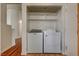Laundry room with washer, dryer, and upper shelving at 540 Viva Serenade Way, Henderson, NV 89015