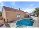 Back exterior view of pool and hot tub, with patio and landscaped yard with private fence at 540 Viva Serenade Way, Henderson, NV 89015