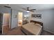 Cozy bedroom with neutral walls, ceiling fan, and adjoining bathroom access at 5648 Vermillion Ridge St, North Las Vegas, NV 89031