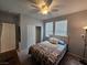 Inviting bedroom with neutral tones, a ceiling fan, window blinds, closet, and comfortable furnishings at 5648 Vermillion Ridge St, North Las Vegas, NV 89031