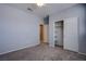 Neutral bedroom with soft carpet, a closet, and a doorway leading to another room at 5648 Vermillion Ridge St, North Las Vegas, NV 89031