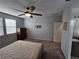Bedroom featuring a ceiling fan, carpet floors, and lots of natural light at 5648 Vermillion Ridge St, North Las Vegas, NV 89031