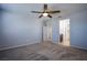 Bright bedroom features a ceiling fan and neutral paint, offering a peaceful retreat at 5648 Vermillion Ridge St, North Las Vegas, NV 89031
