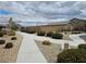 Landscaped community walkway with lush bushes, offering a peaceful environment at 5648 Vermillion Ridge St, North Las Vegas, NV 89031