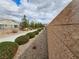 Well-maintained community walkway with lush bushes and rock landscaping, promoting curb appeal at 5648 Vermillion Ridge St, North Las Vegas, NV 89031