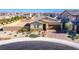 Charming single-story home with manicured landscaping and a brick-paved driveway at 5648 Vermillion Ridge St, North Las Vegas, NV 89031