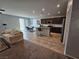 Open concept kitchen features granite countertops, stainless steel appliances, and modern cabinetry at 5648 Vermillion Ridge St, North Las Vegas, NV 89031