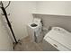 Bright laundry room featuring tile floors, washer, dryer, and convenient overhead shelving at 5648 Vermillion Ridge St, North Las Vegas, NV 89031