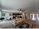 Open-concept living area featuring a modern kitchen with a central island and a cozy seating area at 5648 Vermillion Ridge St, North Las Vegas, NV 89031