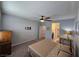 Relaxing main bedroom boasts a ceiling fan, soft carpet, and en-suite bathroom access at 5648 Vermillion Ridge St, North Las Vegas, NV 89031