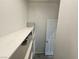 Well-lit pantry with extensive shelving, offering ample storage space for dry goods and other items at 5648 Vermillion Ridge St, North Las Vegas, NV 89031