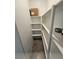 Inside view of a well-organized pantry with multiple shelves for ample food and supply storage at 5648 Vermillion Ridge St, North Las Vegas, NV 89031