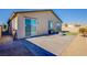 Charming patio with pavers, fire pit, and low-maintenance turf, perfect for outdoor entertaining at 5648 Vermillion Ridge St, North Las Vegas, NV 89031