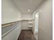 Large walk-in closet featuring ample shelving and rod space for optimal organization at 5648 Vermillion Ridge St, North Las Vegas, NV 89031
