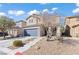 Beautiful two-story home with desert landscaping, stone accents, and a spacious driveway at 5662 Tingley Ave, Las Vegas, NV 89141