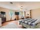 Spacious main bedroom with hardwood flooring, a ceiling fan, and a large dresser at 5775 W Desert Inn Rd, Las Vegas, NV 89146