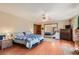 Spacious main bedroom with hardwood flooring, a ceiling fan, and double bed at 5775 W Desert Inn Rd, Las Vegas, NV 89146