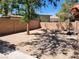 Spacious backyard area with a basketball hoop and block wall fence at 5820 W Desert Inn Rd, Las Vegas, NV 89146