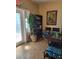 Charming entrance area with tile flooring, seating, bookshelf, and potted tree at 5820 W Desert Inn Rd, Las Vegas, NV 89146