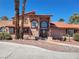 Attractive two-story home with a tile roof, decorative windows, and a well-manicured front yard at 5820 W Desert Inn Rd, Las Vegas, NV 89146