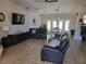 Spacious living room with tile floors, neutral decor, and large windows at 5820 W Desert Inn Rd, Las Vegas, NV 89146