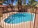 Backyard featuring a fenced in outdoor pool with trees surrounding the property at 5820 W Desert Inn Rd, Las Vegas, NV 89146