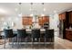 Eat-in kitchen featuring stainless steel appliances, modern cabinetry, and an oversized island with seating at 6217 Starflare St, Las Vegas, NV 89148