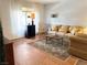 Warm living room features hardwood floors, large window, neutral colors and traditional furnishings at 625 S Royal Crest Cir # 2, Las Vegas, NV 89169