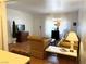 A cozy living room area, featuring hardwood floors, ample natural light, and comfortable seating at 625 S Royal Crest Cir # 2, Las Vegas, NV 89169