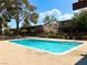 A large community swimming pool with blue water and surrounding greenery at 625 S Royal Crest Cir # 2, Las Vegas, NV 89169