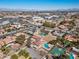 Aerial view of a neighborhood with a home featuring a pool and sports court at 6545 Laredo St, Las Vegas, NV 89146