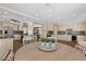 Open-concept kitchen and dining area with granite countertops and stainless steel appliances at 6545 Laredo St, Las Vegas, NV 89146