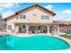 Enjoy a refreshing pool and covered patio in this home's backyard, perfect for relaxing and entertaining at 6611 Ellerhurst Dr, Las Vegas, NV 89103