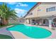 A private backyard oasis with a sparkling pool, patio area, and lush landscaping for serene outdoor living at 6611 Ellerhurst Dr, Las Vegas, NV 89103