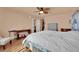 Large bedroom with hardwood floors, a ceiling fan, neutral walls, and comfortable furnishings at 6611 Ellerhurst Dr, Las Vegas, NV 89103