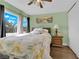 Bright bedroom featuring hardwood floors, a decorative ceiling fan and a window view at 6611 Ellerhurst Dr, Las Vegas, NV 89103